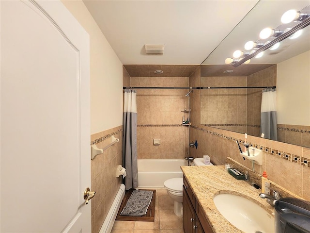 full bathroom featuring shower / tub combo with curtain, tile walls, a baseboard heating unit, tile patterned floors, and toilet