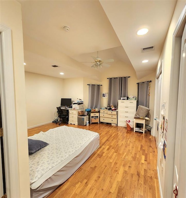 bedroom with light hardwood / wood-style floors and ceiling fan