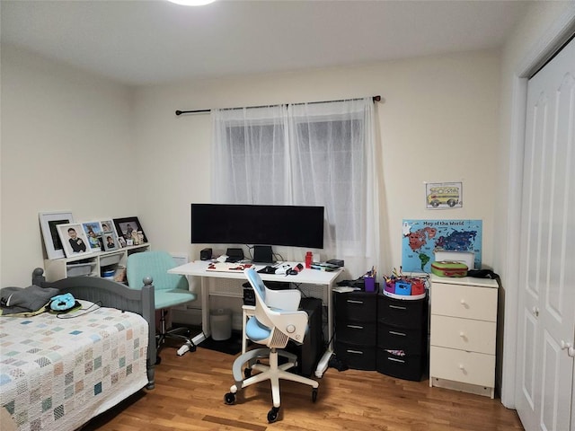 bedroom with light hardwood / wood-style floors