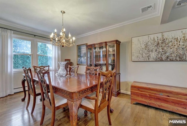 dining room with a baseboard heating unit, a chandelier, light wood-type flooring, and ornamental molding