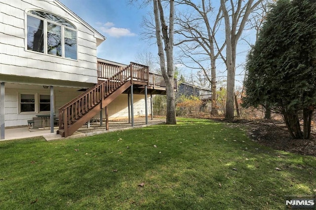 view of yard with a deck and a patio area