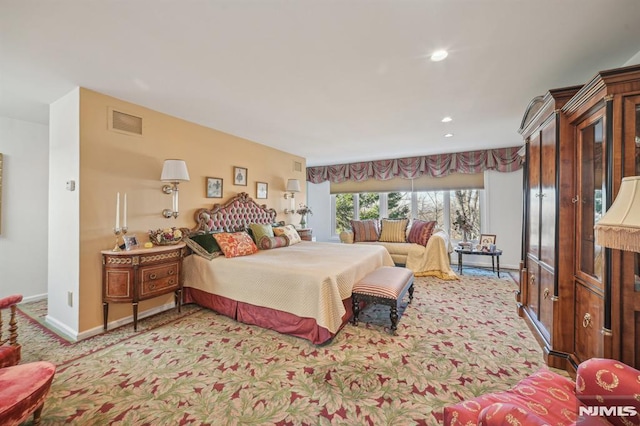 bedroom featuring light carpet