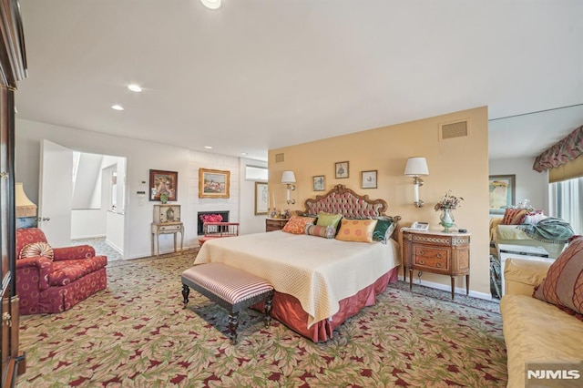 bedroom with a large fireplace