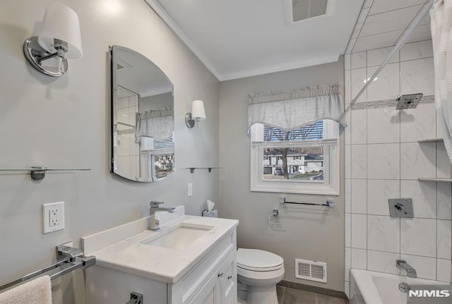 full bathroom with toilet, tiled shower / bath combo, crown molding, and vanity