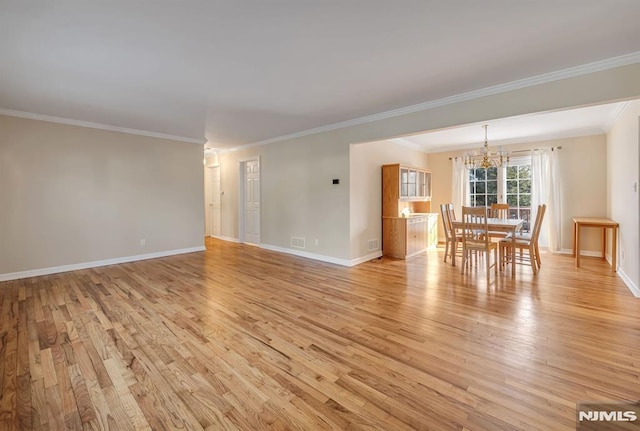 interior space featuring light wood-type flooring and ornamental molding