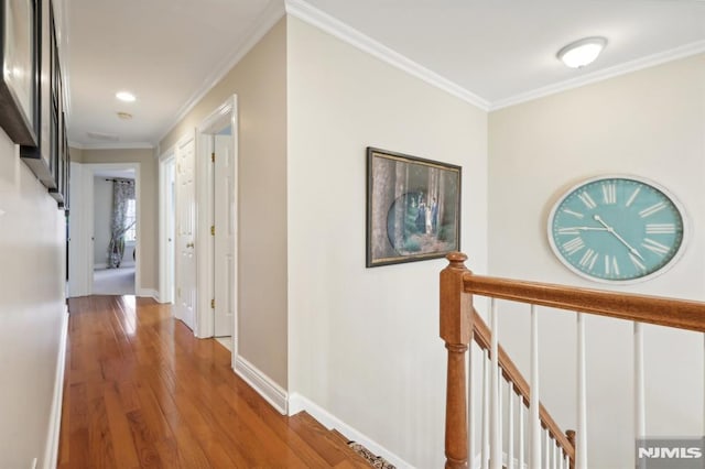 corridor featuring crown molding and wood-type flooring