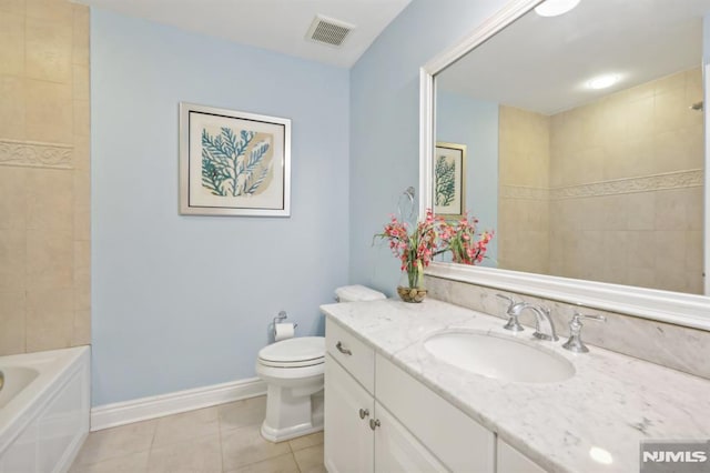 full bathroom with toilet, tile patterned flooring, vanity, and tiled shower / bath combo