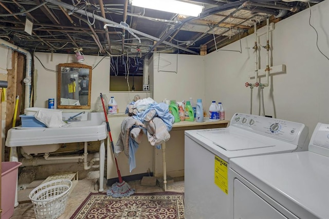 laundry room featuring sink and independent washer and dryer