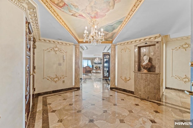 entrance foyer with a raised ceiling, crown molding, and a notable chandelier