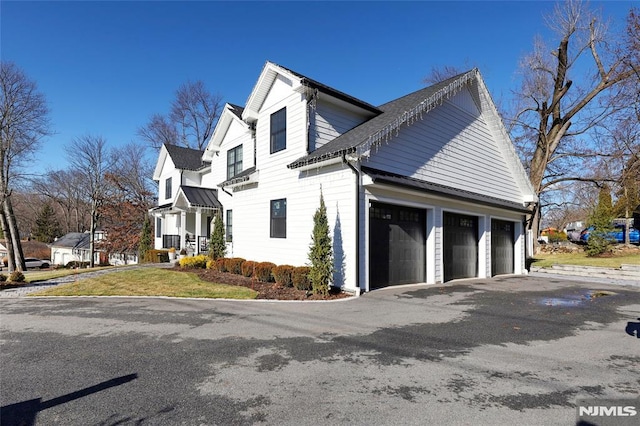 view of side of home with a garage