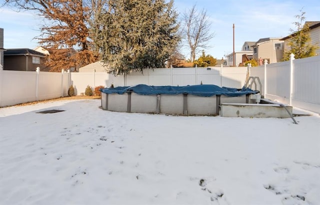 view of yard featuring a covered pool