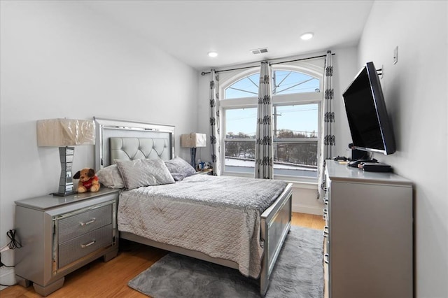 bedroom with hardwood / wood-style floors