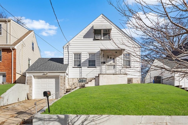 view of front of property with a front yard and a garage