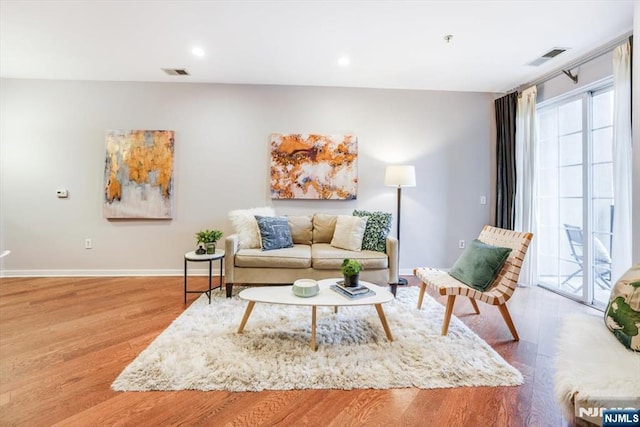 living room with light hardwood / wood-style floors