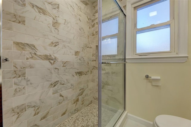 bathroom featuring walk in shower and a wealth of natural light