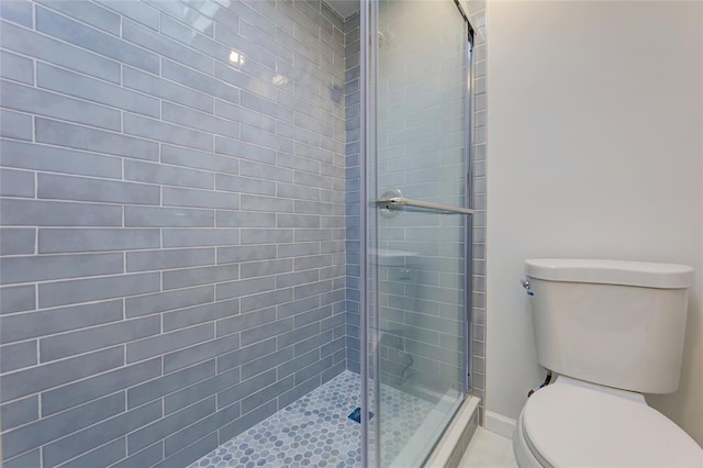 bathroom with toilet and walk in shower