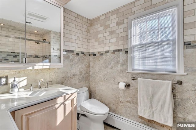 bathroom with walk in shower, a baseboard heating unit, toilet, vanity, and tile walls