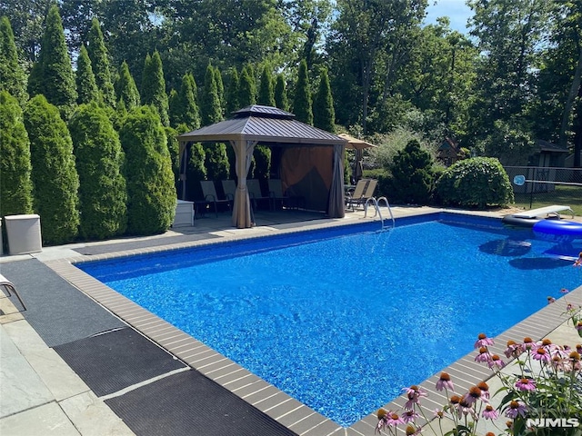 view of pool with a gazebo and a patio