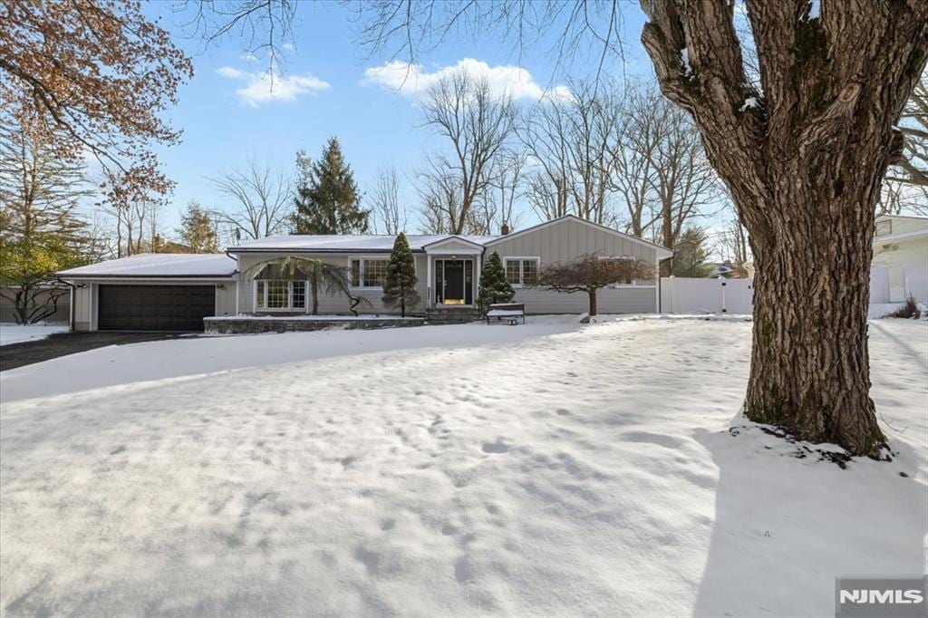 ranch-style home featuring a garage