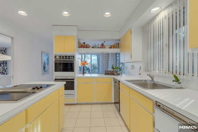 kitchen featuring sink, white appliances, and light tile patterned floors