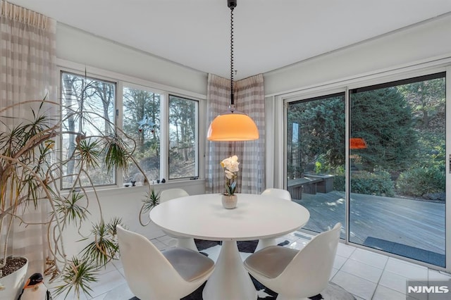 unfurnished dining area with light tile patterned floors