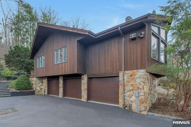 view of side of property featuring a garage