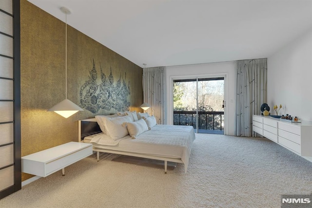 bedroom featuring carpet flooring and access to exterior