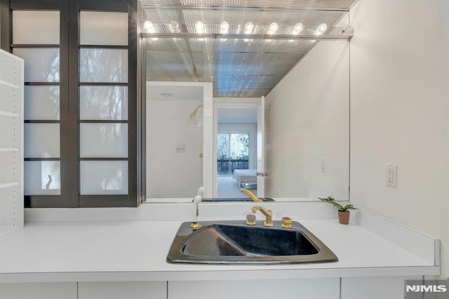 kitchen with sink and white cabinetry