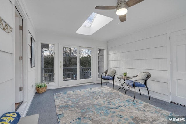 sunroom with ceiling fan and a skylight