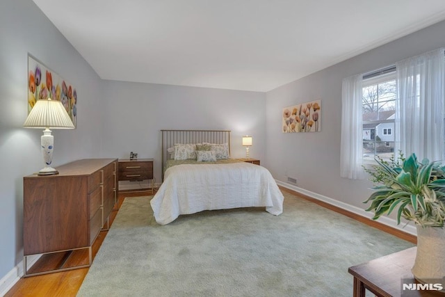 bedroom featuring light hardwood / wood-style floors