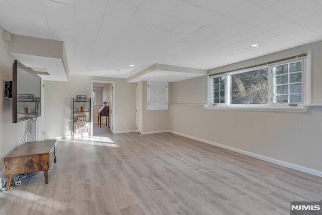 unfurnished living room with light hardwood / wood-style flooring