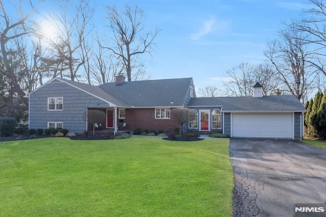 ranch-style home featuring a front yard and a garage