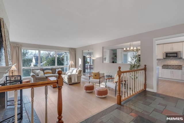 living room featuring a notable chandelier