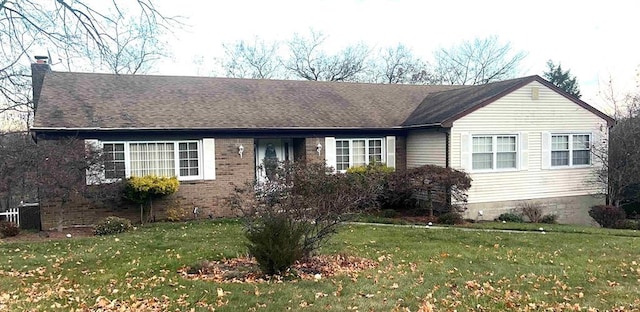 ranch-style house featuring a front lawn