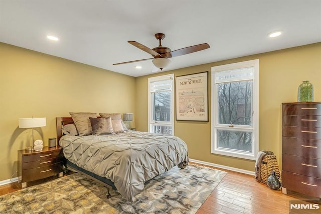 bedroom featuring ceiling fan and light hardwood / wood-style flooring