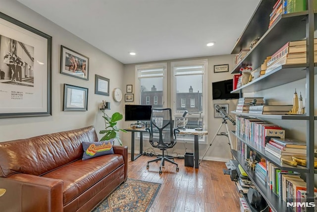 office with hardwood / wood-style flooring