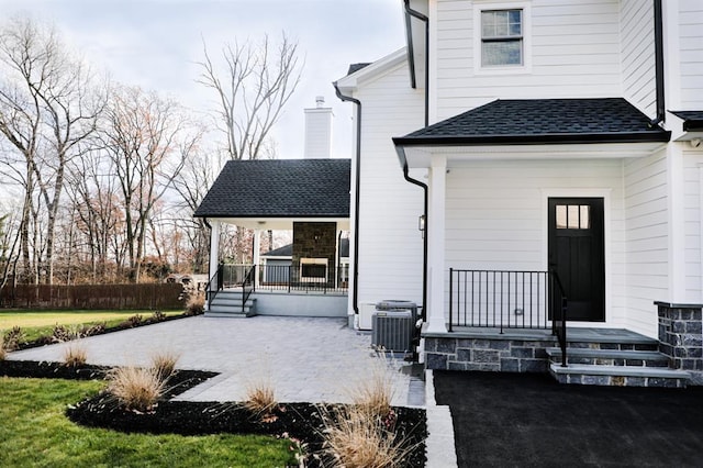 exterior space with cooling unit and covered porch