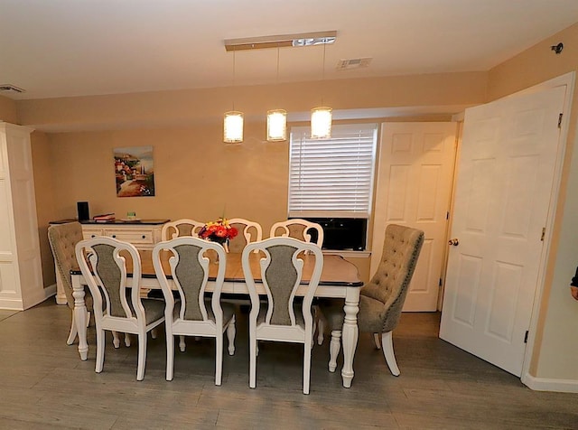 dining room with dark hardwood / wood-style floors