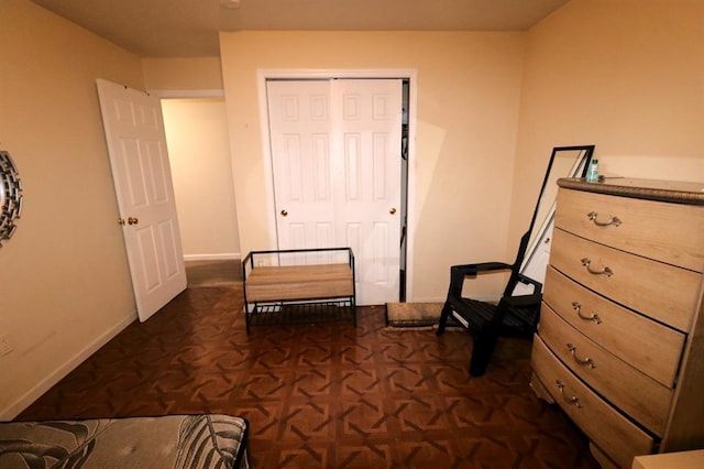 sitting room with dark parquet flooring