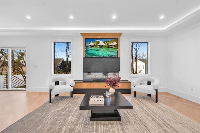 living room featuring a healthy amount of sunlight and parquet flooring