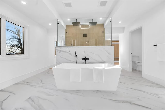 bathroom featuring shower with separate bathtub and toilet