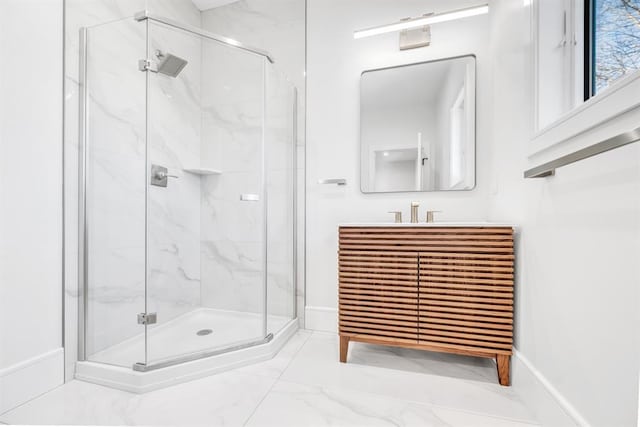 bathroom featuring vanity and a shower with shower door