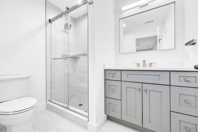 bathroom featuring vanity, toilet, and walk in shower