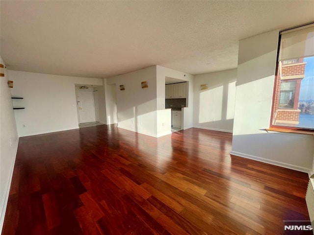 unfurnished room with hardwood / wood-style flooring