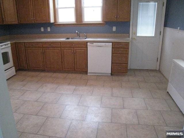 kitchen featuring sink and white appliances