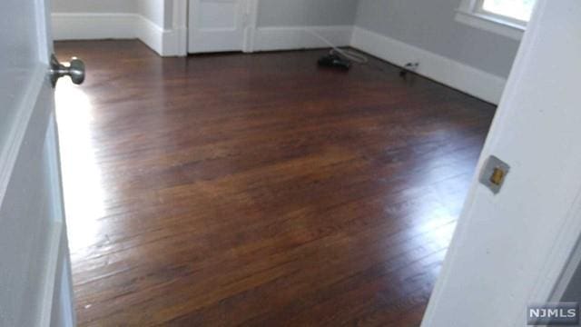 interior details featuring hardwood / wood-style flooring