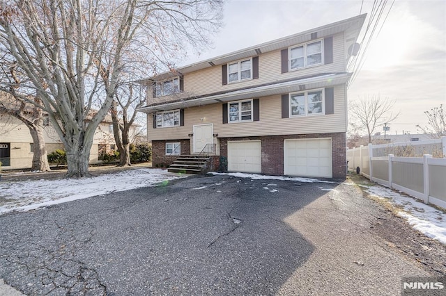 bi-level home featuring a garage