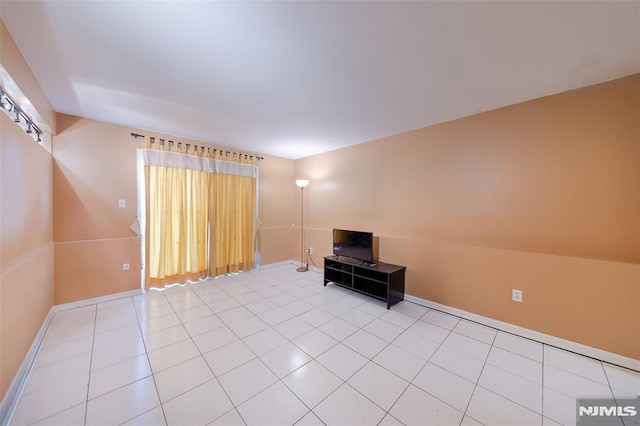 unfurnished living room featuring light tile patterned floors