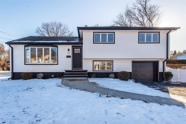 split level home featuring a garage