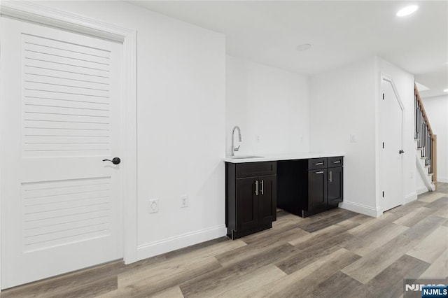 interior space featuring sink and light hardwood / wood-style floors